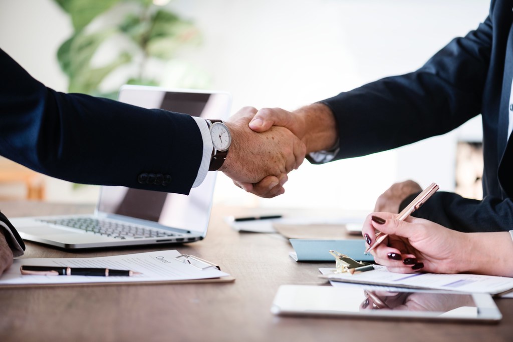 Professional business meeting and agreement representing customer satisfaction